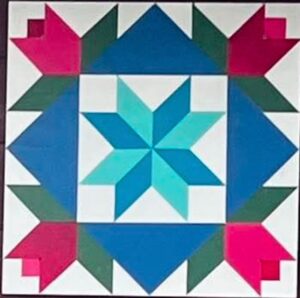 Barn quilt with an eight-pointed teal and aqua star at the center, framed by blue triangles and surrounded by four pink tulip blossoms with green leaves in the corners, on a white background.
